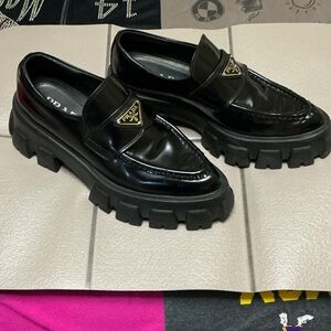 Prada Women’s Black Monolith Loafer triangle logo Lug-Sole Leather Loafers